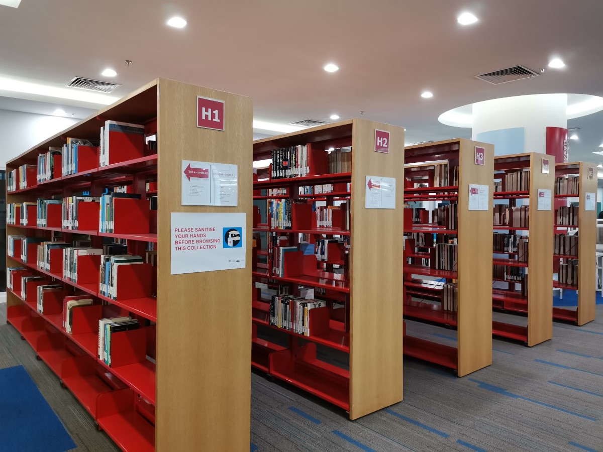 Organised shelves and rows of books in Sunway University’s library