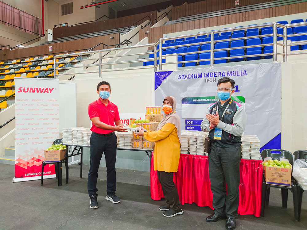 Frontline workers at Stadium Indera Mulia PPV in Ipoh, Perak