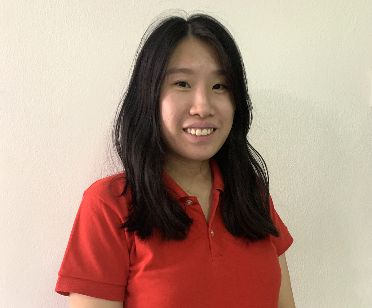 Portrait shot of Ms. Ng Poh Li of the Sunway Group Sustainability Unit (GS) in the red Sunway t-shirt