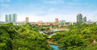 A panoramic shot of Sunway City Kuala Lumpur, surrounded by greeneries and the various business divisions