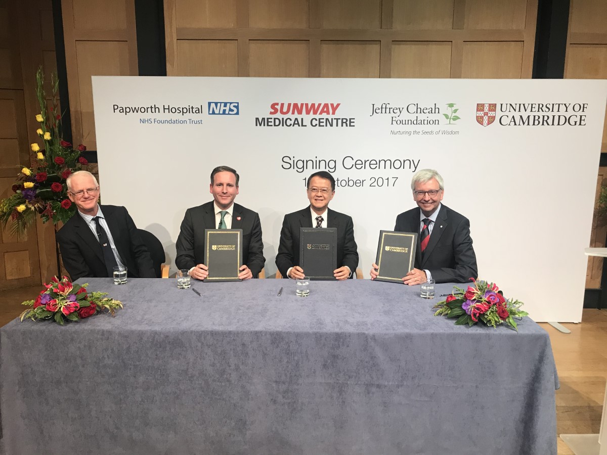 A group shot of the signing ceremony at the University of Cambridge