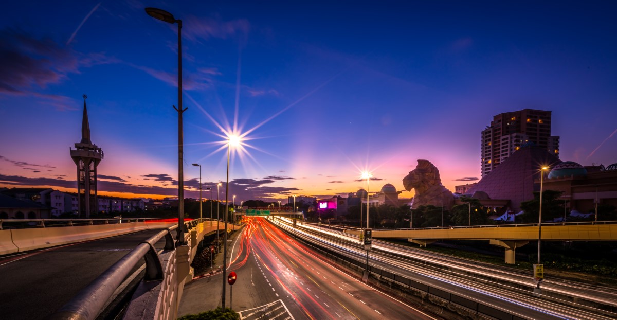 A wide angle long exposure shot of the bustling streets by Sunway Pyramid at dusk.