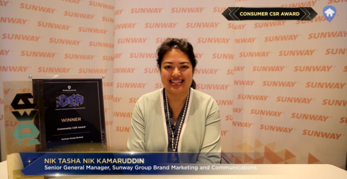 A close up portrait shot of Sunway Group Brand Marketing & Communications senior general manager Nik Tasha Nik Kamaruddin expressing her delight to accept the CSR award on behalf of the Group at iProperty Development Excellence Awards (iDEA) 2021 remotely