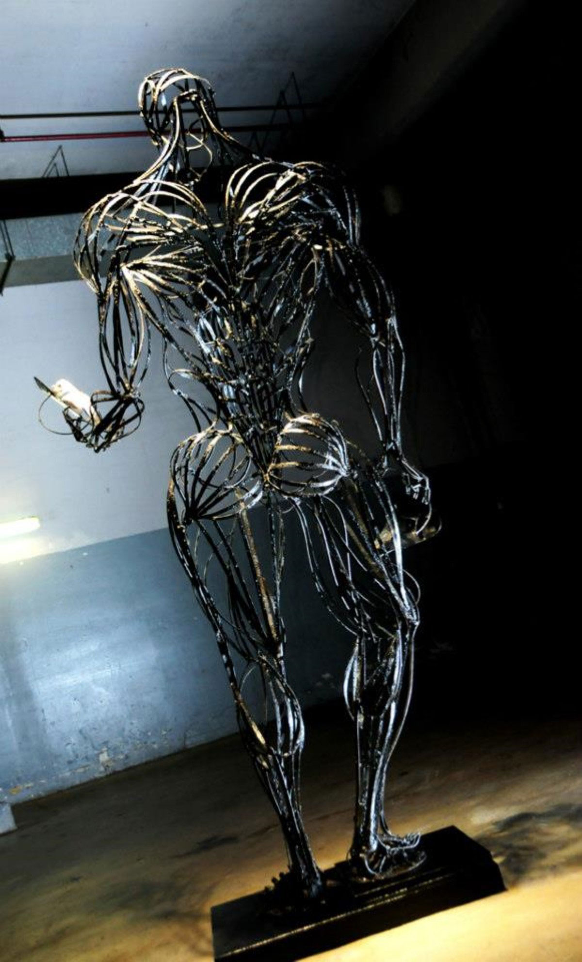 A steel line sculpture of a man’s full body from the back called ‘Anatomy of Hope’.