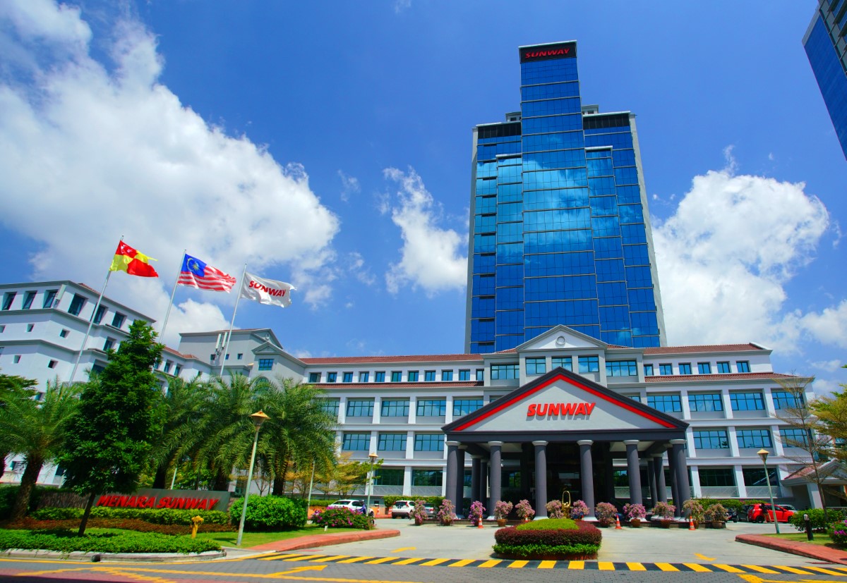 A wide shot of the Menara Sunway headquarters located at Sunway City Kuala Lumpur under bright blue skies.