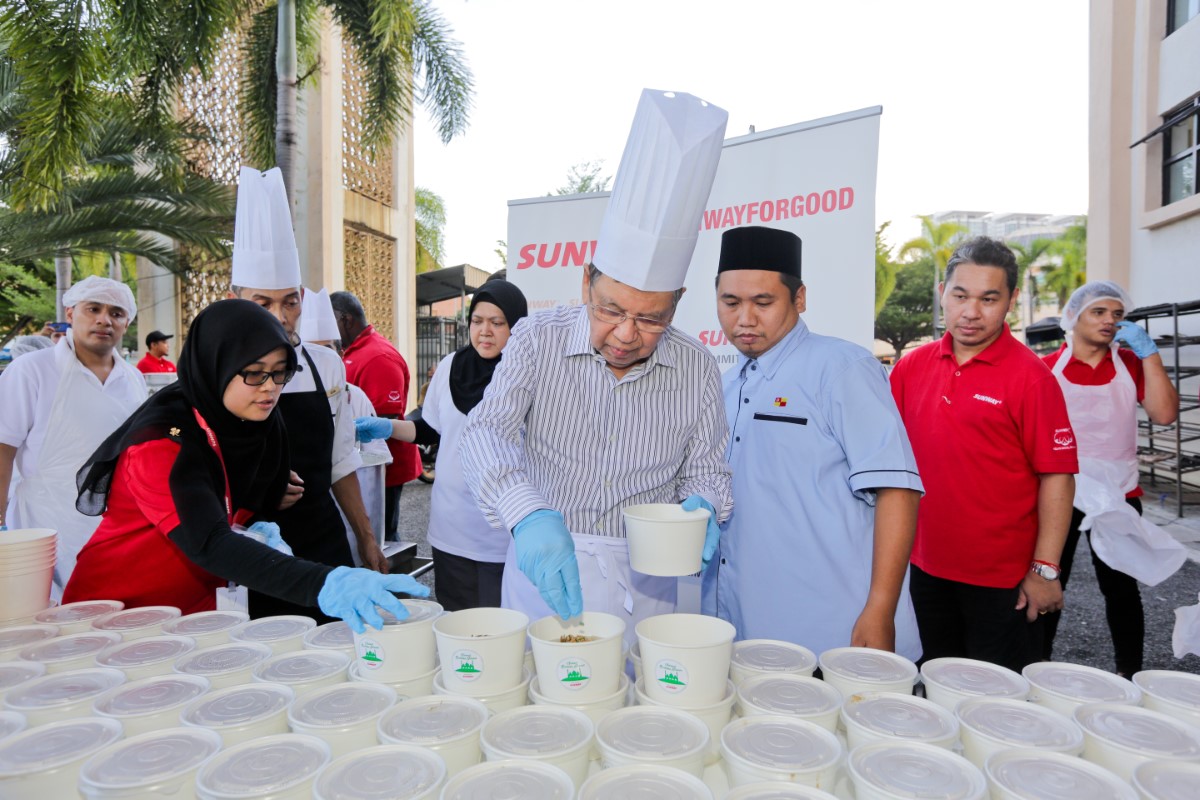 Candid shot of Sunwayians preparing bubur lambuk