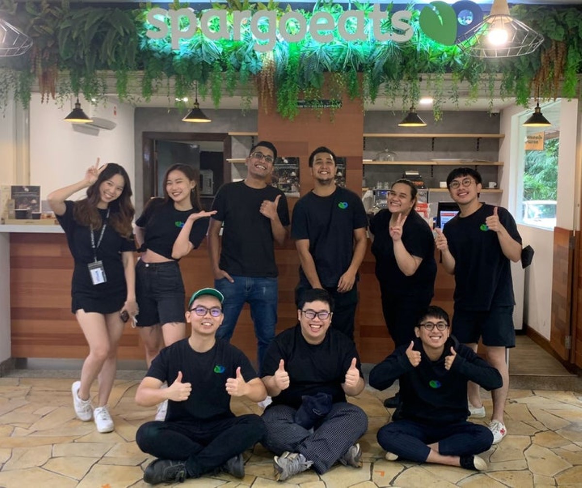 A full landscape shot of the crew behind Loop Foods and SpargoEats’ success, each dressed smartly in SpargoEats’ uniform, posing cheerfully at SpargoEats’ flagship store in Sunway FutureX, Sunway City Kuala Lumpur