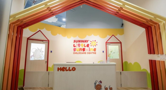 A full landscape shot of Sunway Little Sunshine Childcare Centre’s front counter, boasting Sunway City Kuala Lumpur’s signature colour schemes and bright motifs