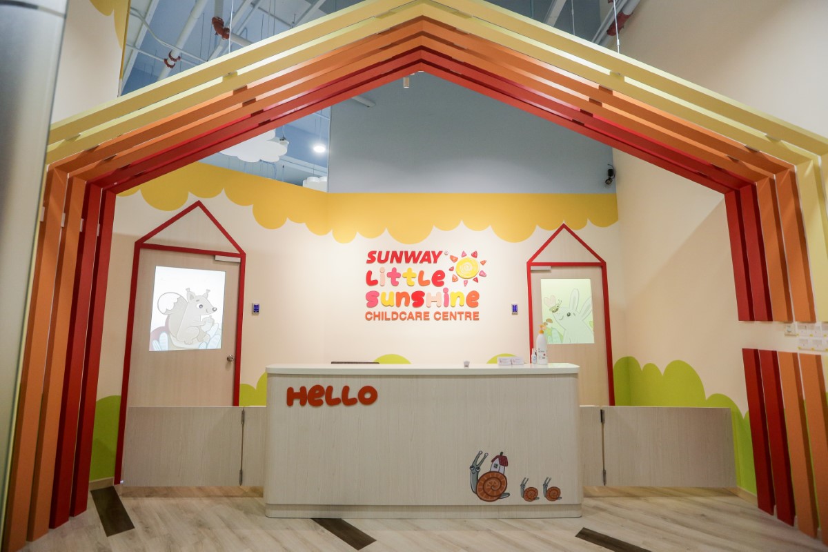 A full landscape shot of Sunway Little Sunshine Childcare Centre’s front counter, boasting Sunway City Kuala Lumpur’s signature colour schemes and bright motifs