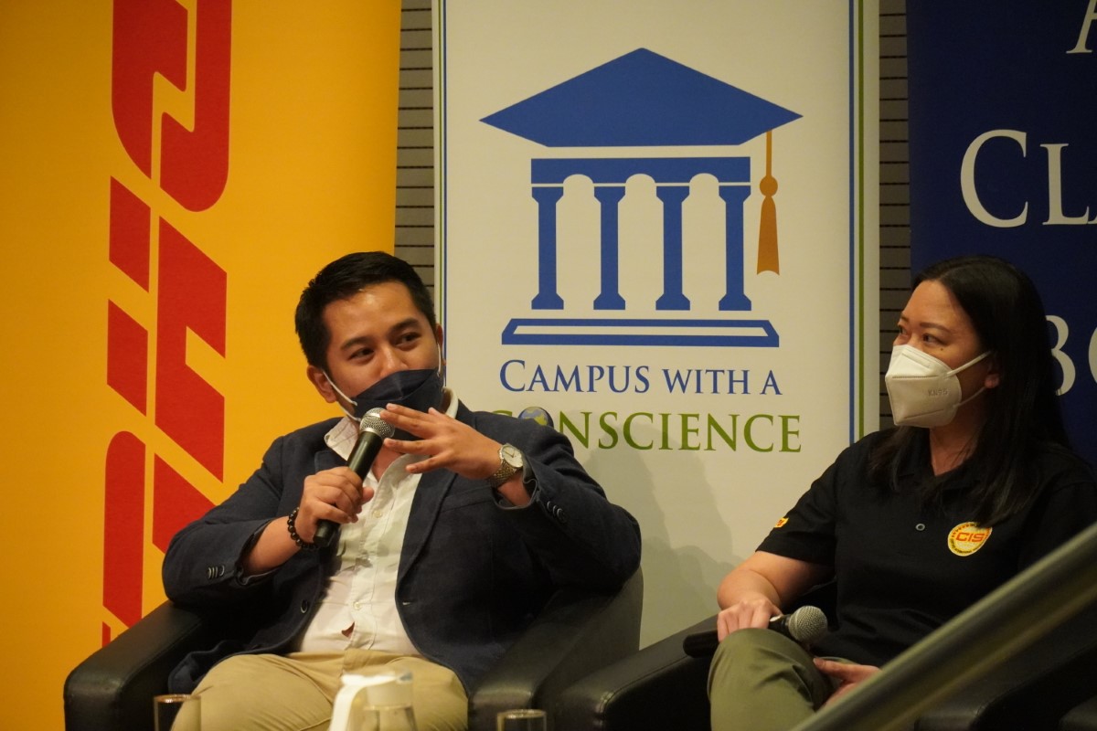 Sunway Centre for Planetary Health Chief Planetary Scientist Dr Renzo Guinto with DHL Express Malaysia Head of Business Transformation Liew Hun Ni, sitting in the forefront of DHL and Sunway University bunting at Sunway University.