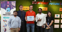 Sunway iLabs Director Matt Van Leeuwen and iLabs Foundry Director Karen Lau Kai Zhia alongside students of Sunway University posing with the Make It Challenge plaque at Sunway FutureX.