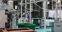 Wide shot of a worker at the laundry plant