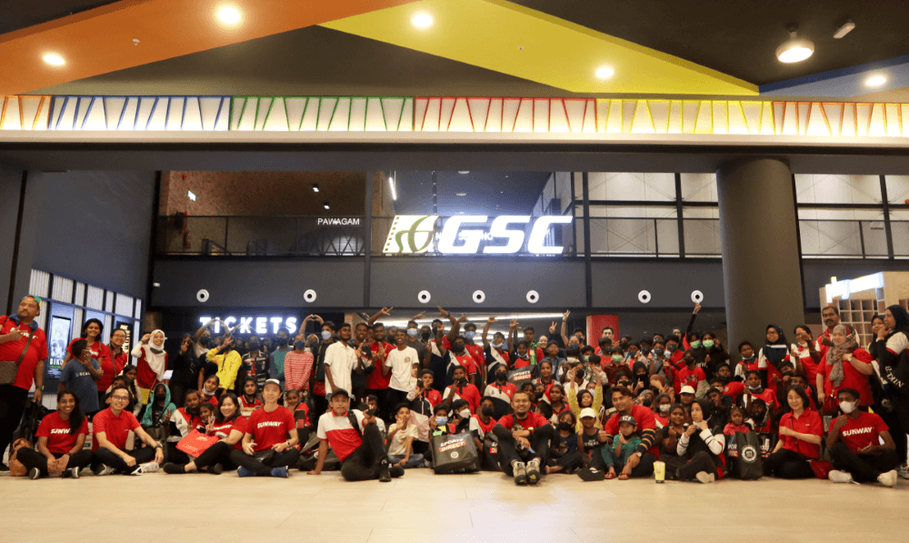A group photo featuring the Sunway staff and the children at the movie screening at Golden Screens Cinemas.