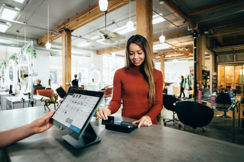 A candid shot of a lady accessing data on a tablet