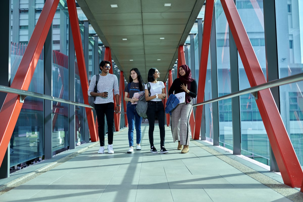 Candid shot of students on the link bridge at Sunway University