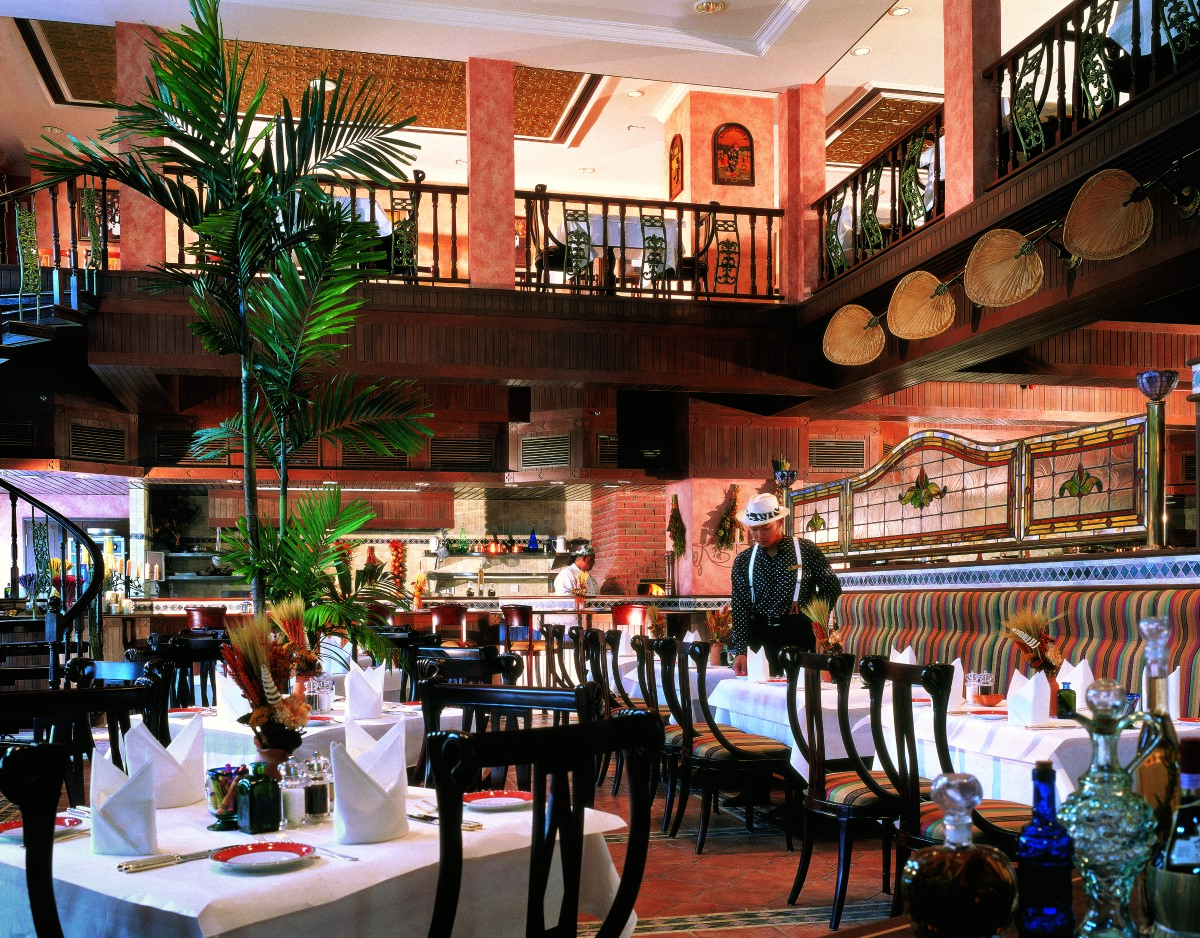 Avanti Ristorante with chairs and tables and a waiter.