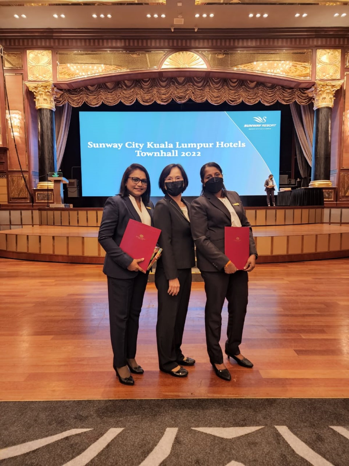 Shanta alongside two other colleagues at the Long-Service Award of Sunway at Sunway Resort Hotel.