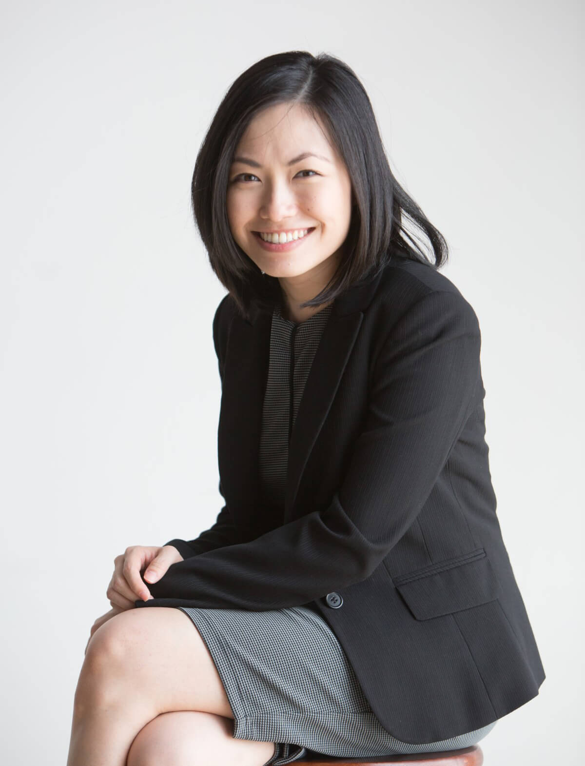 Teh Li-Jian, Head of talent management & employer branding of Group human resources at Sunway Group posing for a portrait shot, dressed in a grey dress and black blazer