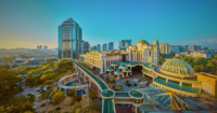 A panoramic shot of Sunway City Kuala Lumpur during dawn time. Featuring the Canopy Walk and Sunway buildings such as Sunway Resort Hotel, Sunway Pinnacle and Sunway Pyramid as well as greeneries.