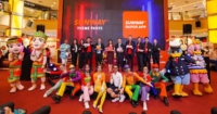 A full landscape shot of YB Teo Nie Ching alongside Sunway Group leaders Tan Sri Chew Chee Kin, Nik Tasha, Lew Yen Fong, Kevin Khoo, Evan Cheah, Chan Hoi Choy, Calvin Ho, Kong Beng Kuin, and Michelle Soong