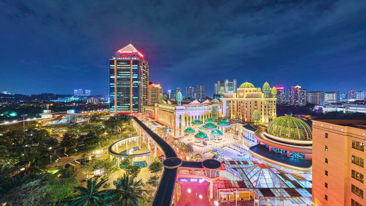 A night shot of Sunway City Kuala Lumpur. With Sunway Pinnacle in the background, as well as Sunway Resort Hotel in the foreground. Surrounded by trees and our canopy walk.
