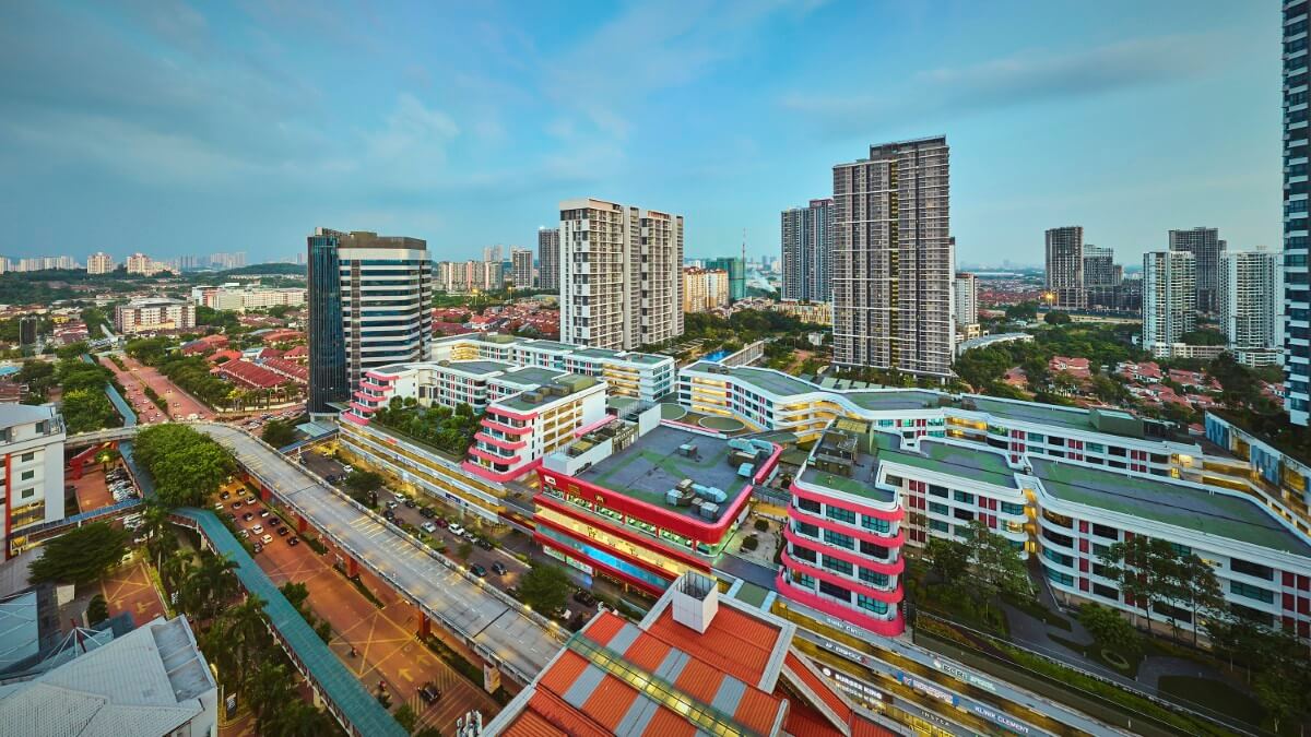 A dusk drone shot of Sunway City Kuala Lumpur. Showcasing the BRT track and Sunway Geo Avenue.