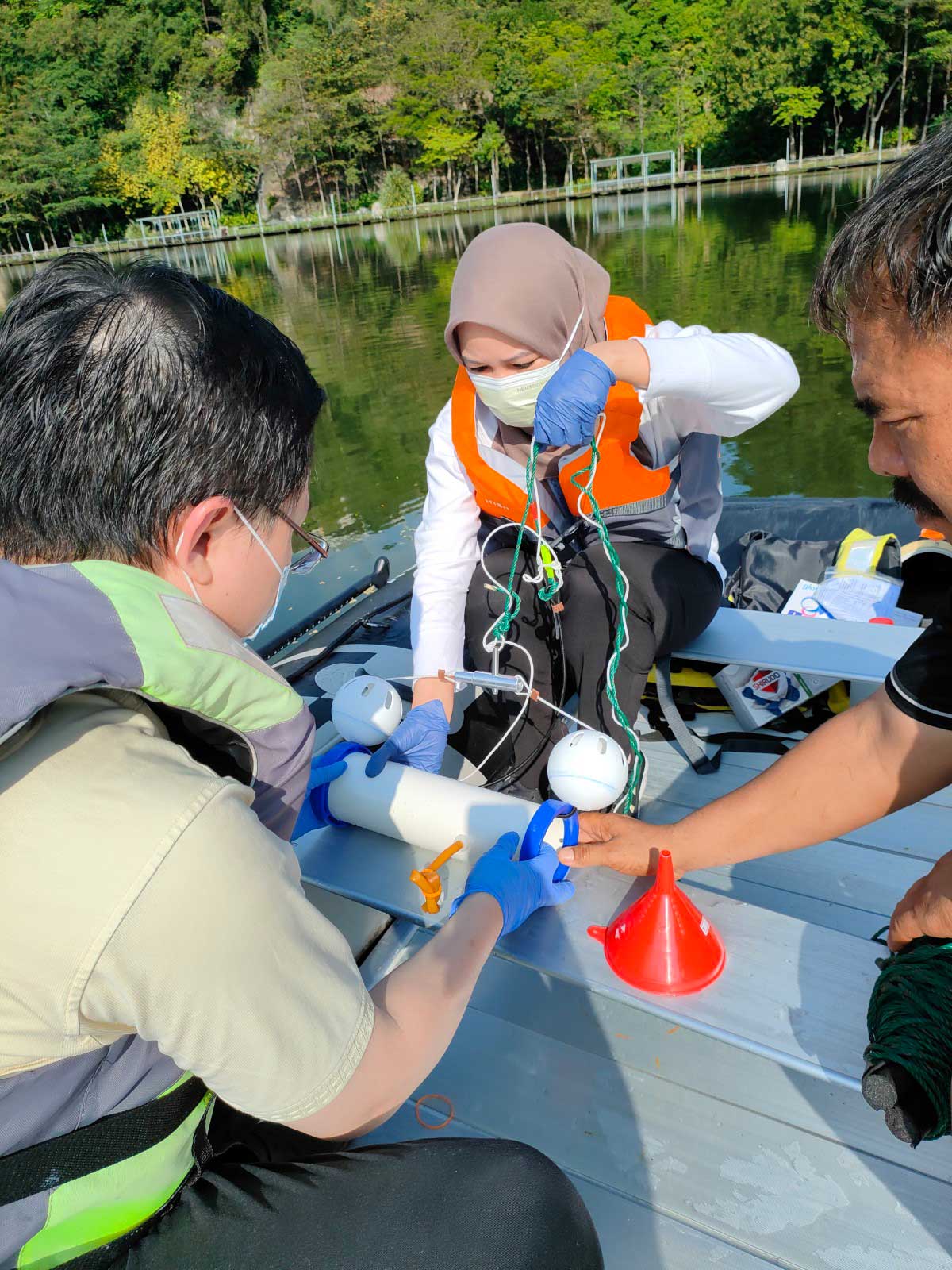 Dr. Chen and his team at Sunway South Quay lake doing water sampling for water quality research.