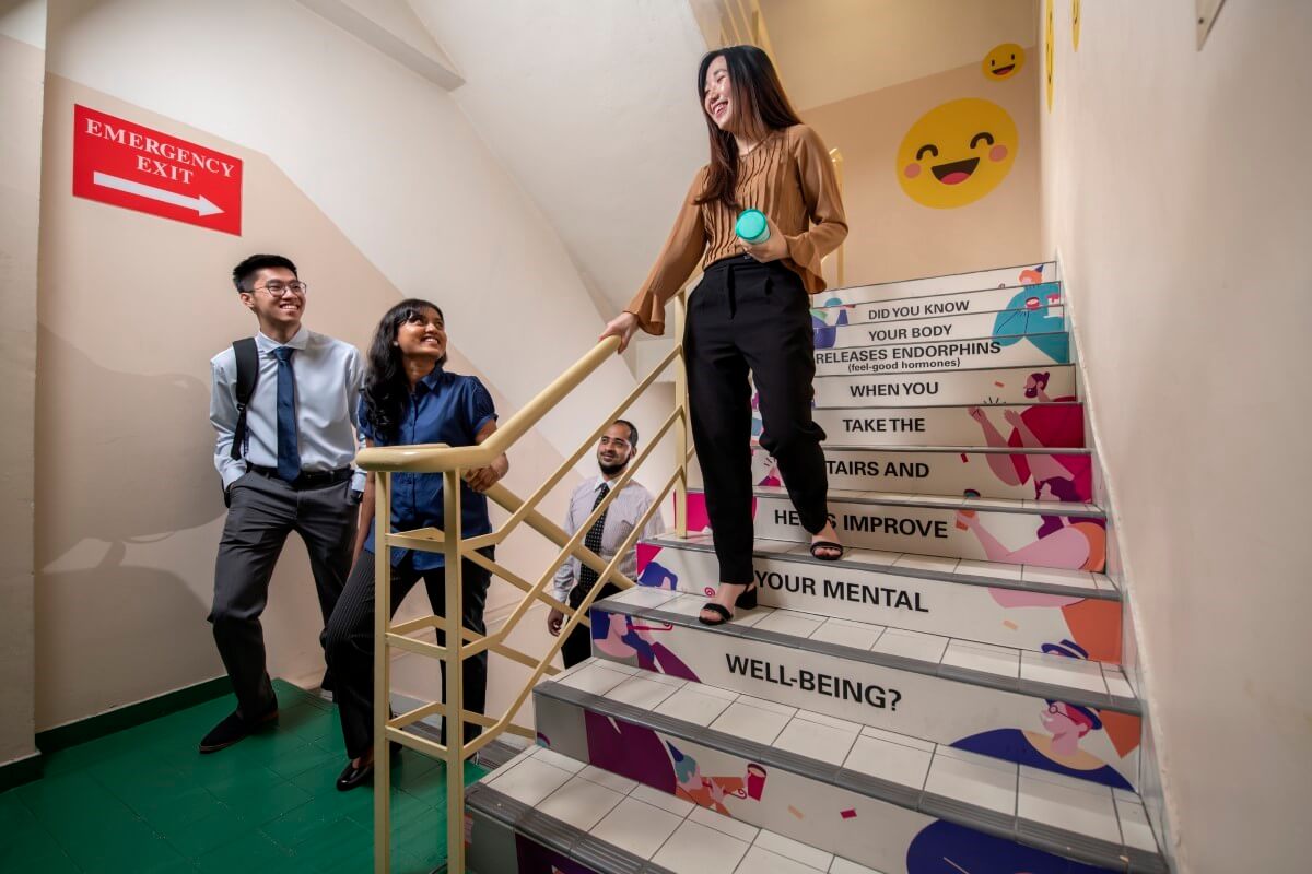 Candid shot of employees taking the office stairs