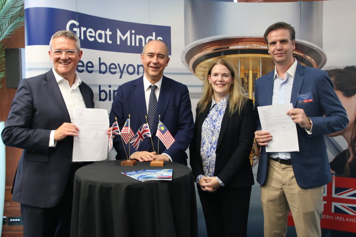 A medium full landscape shot of David Groom, Lord Dominic Johnson, Natalie Black CBE, and Sunway Group chief innovation officer Matt van Leeuwen commemorating the Sunway iLabs-Deeptech Labs partnership in London