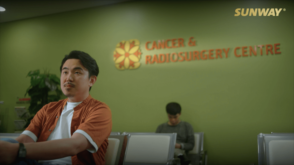 A midshot of a man sitting at the Cancer & Radiosurgery Centre in Sunway Medical Centre