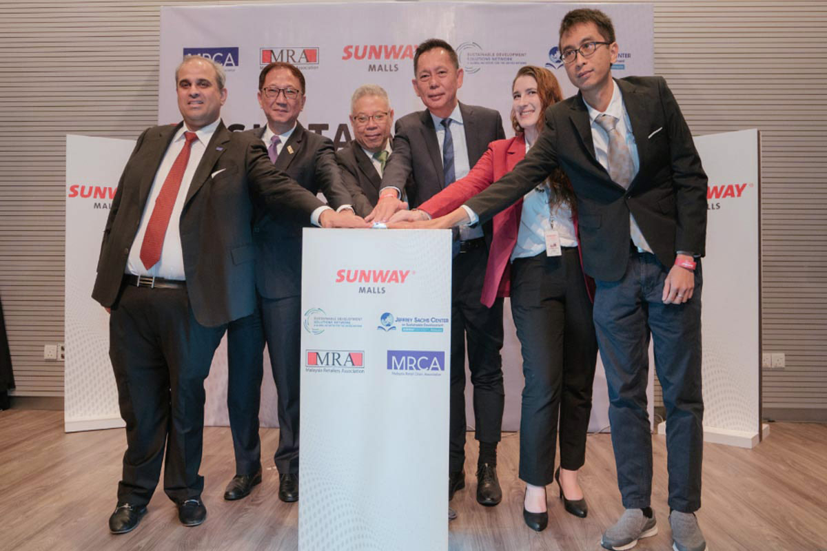 A full shot of Sunway senior leaders alongside partners at the Sunway Malls launch of Sustainability Collaboration Alliance Network (SCAN), jointly pressing the button to launch the initiative.