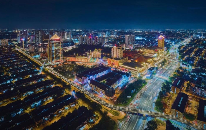 A drone night shot of Sunway City Kuala Lumpur, featuring resplendent lights and a digitalised look.
